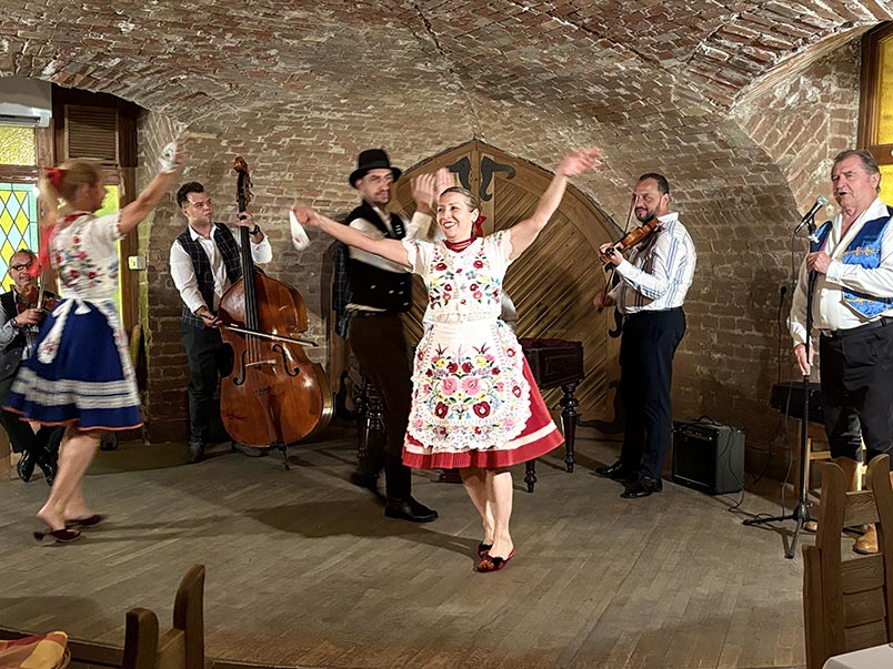 Musicians and dancers performing during the Folklore dinner